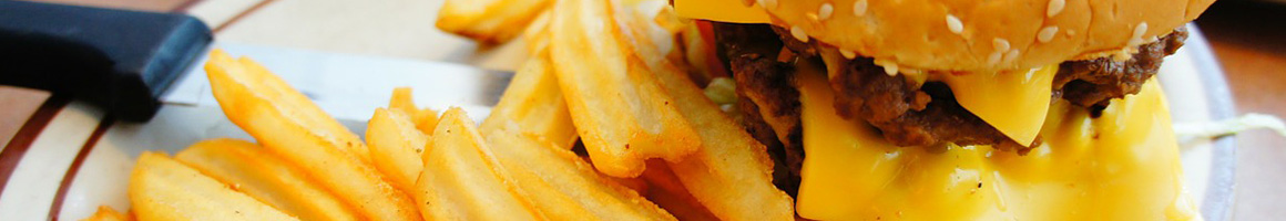 Eating Burger Gastropub Salad at Dukes Plates & Pints restaurant in Sacramento, CA.